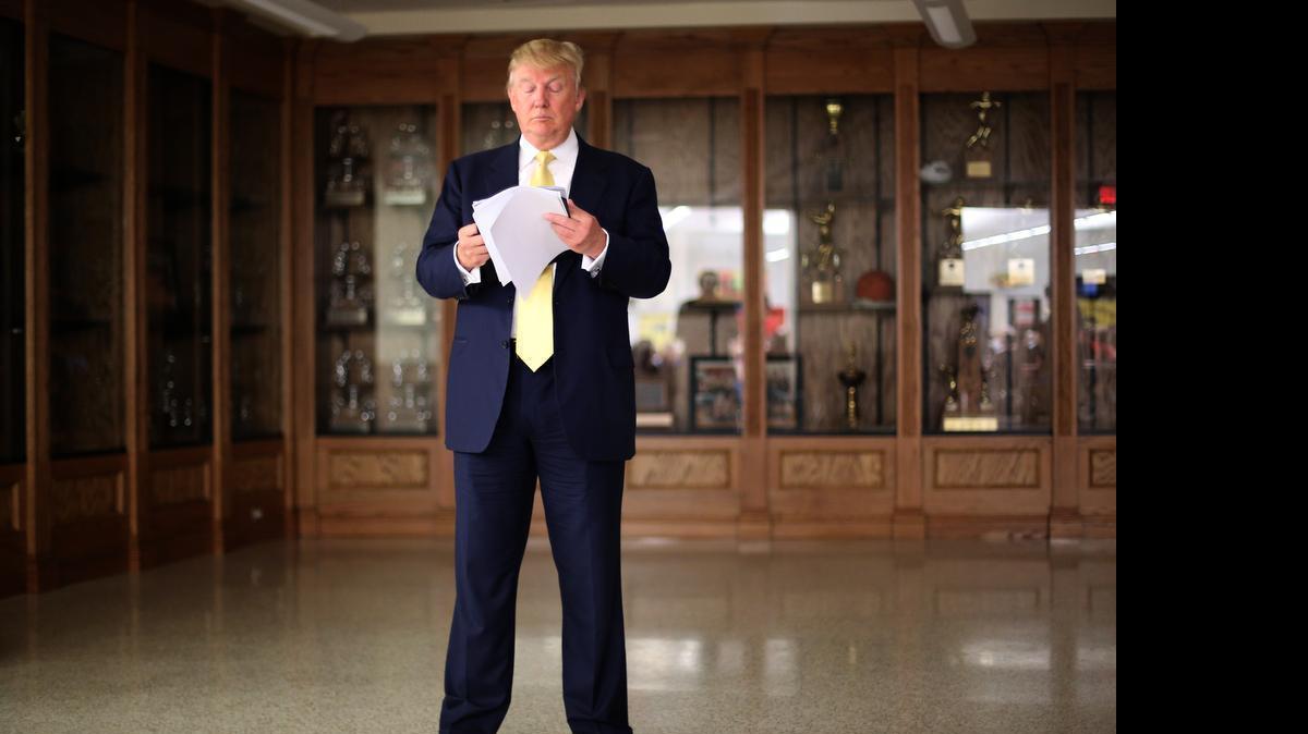 
Republican presidential candidate Donald Trump prepares to speak from a cafeteria at a high school during a campaign stop in Winterset, Iowa, Saturday, June 27, 2015. 
