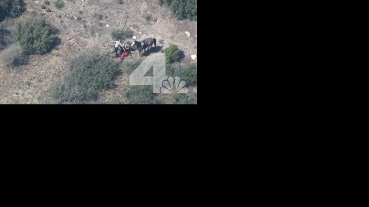 
In this frame from video provided by KNBC-TV, officers beat and kick a man Thursday, April 9, 2015, near Apple Valley, Calif. A Southern California sheriff on Thursday ordered an immediate investigation after deputies were recorded beating and kicking a man who fled in a car and on horseback. 
