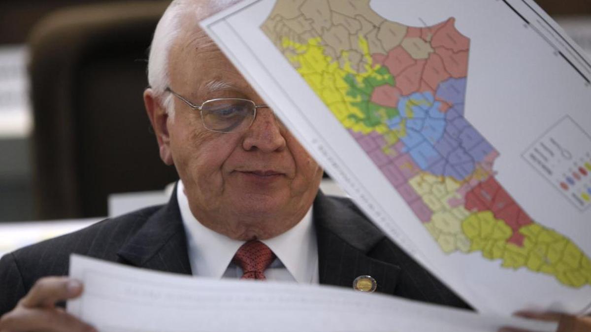 Rep. John Faircloth checks maps during a meeting of the joint redistricting committees Nov. 7, 2011. North Carolina lawmakers had returned for a special legislative session.