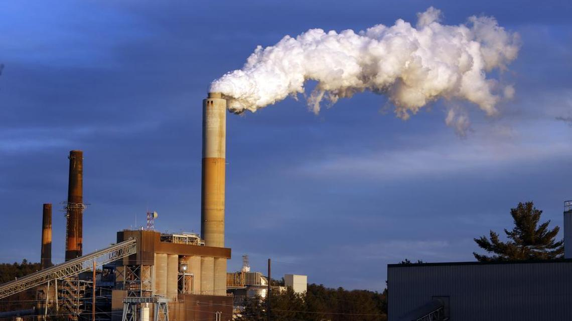 
A plume of steam billows from the coal-fired Merrimack Station in Bow, N.H. President Barack Obama on Monday, Aug. 3, 2015, will unveil the final version of his unprecedented regulations clamping down on carbon dioxide emissions from existing U.S. power plants. The Obama administration first proposed the rule last year. Opponents plan to sue immediately to stop the rule's implementation. 
