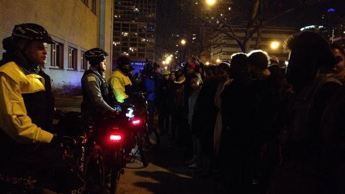 Protesters make their way to the 1st District Police Station, where police block their entry, in this photo tweeted by a reporter on the scene.