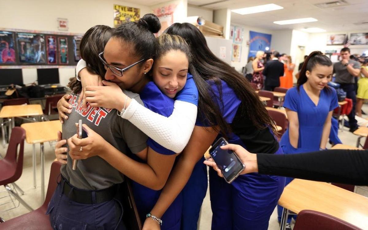 Miami, Florida, May 9, 2017- Thalia Rodriguez receives a group hug from her friends after the press conference at Westland Hialeah High.