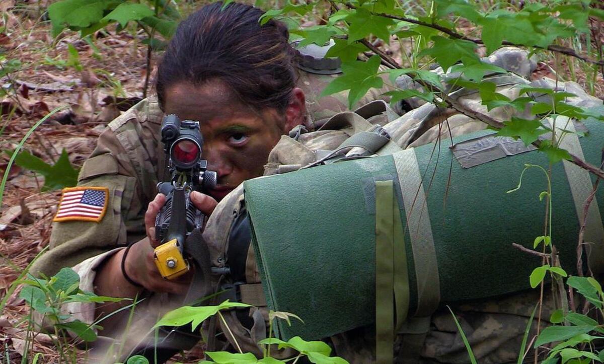 A female soldier in Alpha Company, 1st Battalion, 19th Infantry Regiment stays alert recently during the final field training exercise of One Station Unit Training at Fort Benning, Georgia.The third and final phase of U.S. Army gender integration reached a significant milestone Friday when 18 women graduated from active duty basic training at Fort Benning, becoming infantrymen.