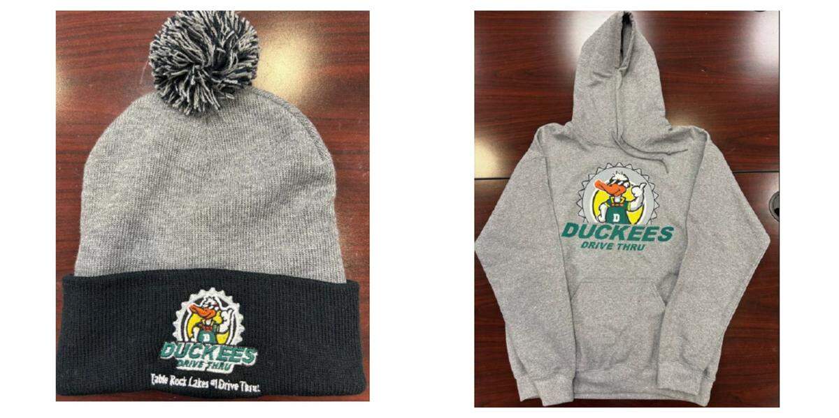 A hat and hoodie with the Duckees logo.