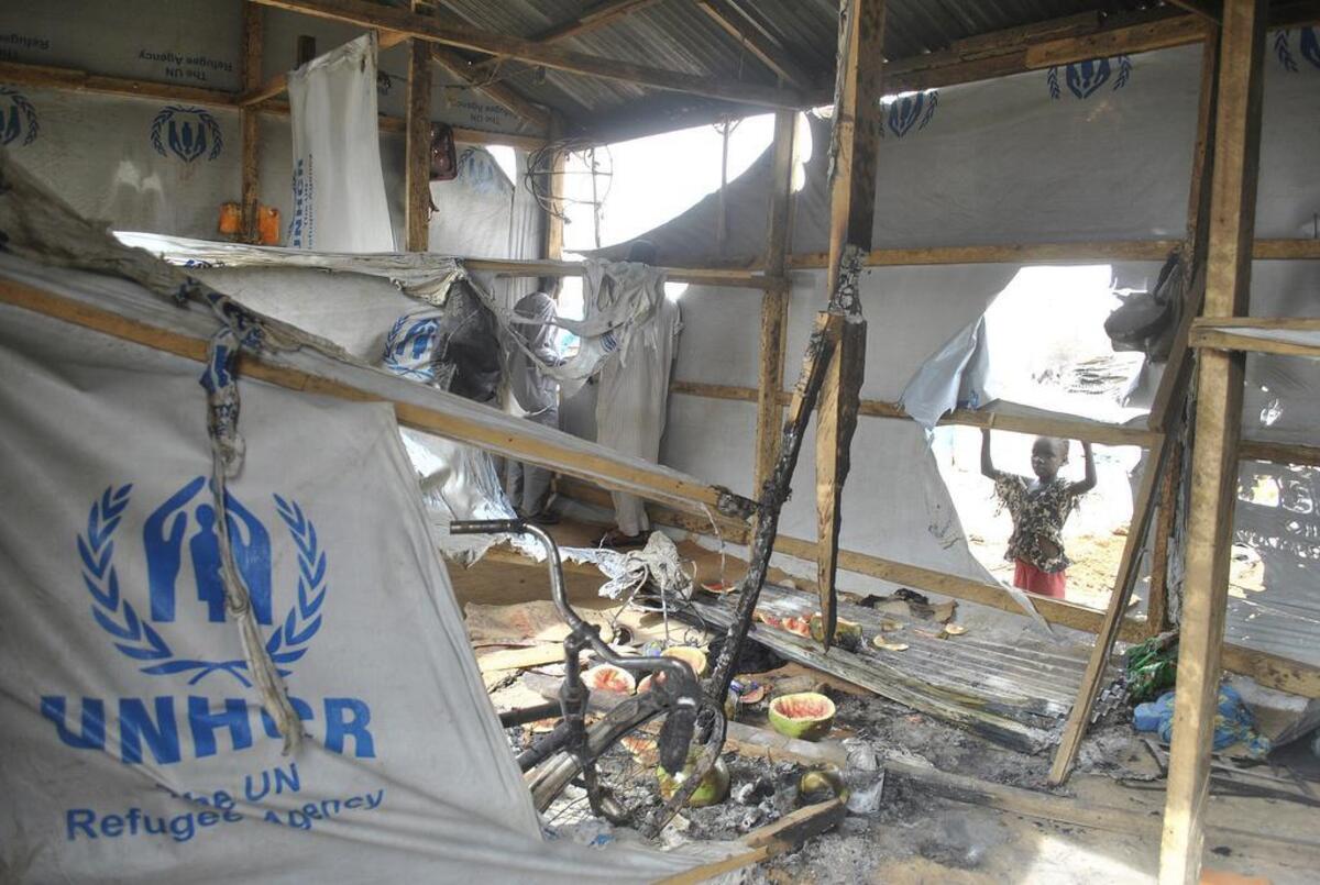 A child looks at the damage at a camp for people displaced following an explosion by Islamist extremists, in Maiduguri, Nigeria, Thursday, June 8, 2017. Authorities in northeast Nigeria say at least six people are dead and dozens are wounded after Boko Haram militants launched a series of attacks during the Muslim holy month of Ramadan.