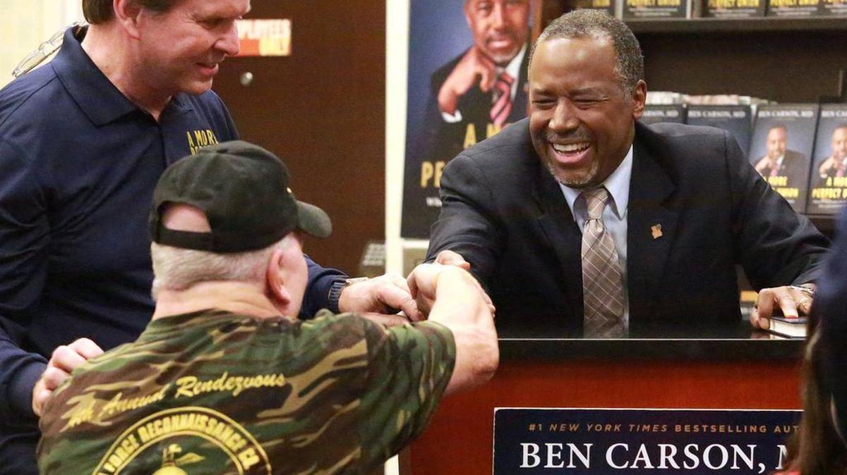 Republican presidential candidate Ben Carson shakes hands with a supporter at a signing of his book, “A More Perfect Union,” at the Lauderdale Barnes and Noble on Thursday, Nov. 5, 2015, in Fort Lauderdale, Fla.