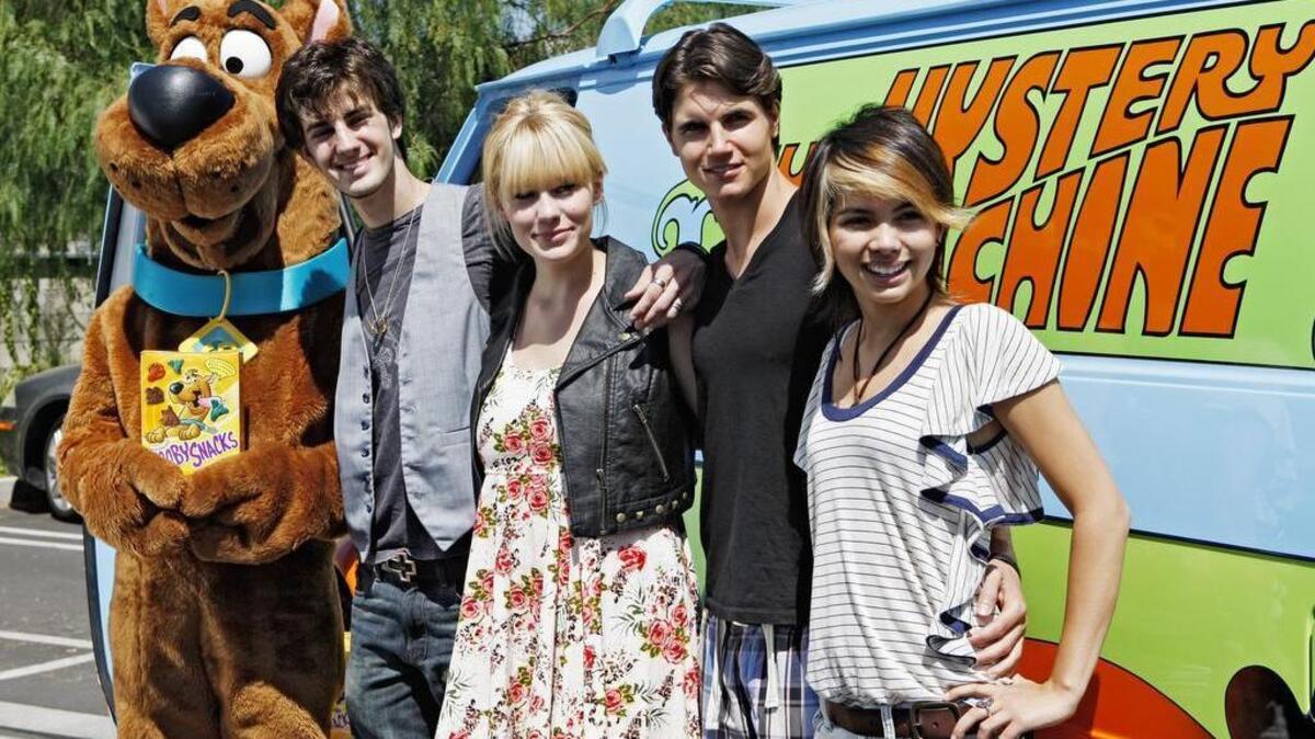 From left to right, cartoon character Scooby-Doo, actors Nick Palatas, Kate Melton, Robbie Amell and Hayley Kiyoke attend the 40th birthday celebration of “Dog Whisperer” host Cesar Millan and cartoon Scooby-Doo in Los Angeles on Sept. 8, 2009. A van resembling the “Mystery Machine” was involved in a high-speed chase in Redding, Calif.