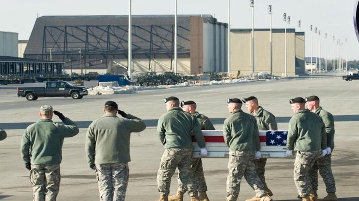 A U.S. Army carry team transfers the remains of Army Sgt. Jose M. Cintron Rosado, of Vega Alta, Puerto Rico, at Dover Air Force Base, Del., Jan. 5, 2011. Cintron Rosado and Jose Delgado Arroyo, also killed in Iraq, were in the same unit as Esteban Santiago, arrested in the Jan. 6 shooting at Fort Lauderdale Hollywood International Airport.