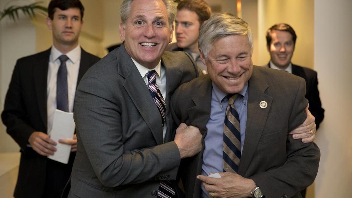 House Majority Leader Kevin McCarthy of California, left, and Rep. Fred Upton, R-Mich., laugh together as they walk from a meeting on Capitol Hill in Washington, Monday, Oct. 26, 2015.
