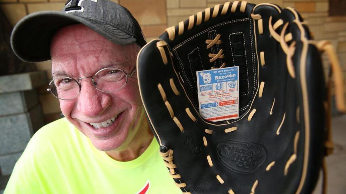 Darwin Day with the baseball glove he recently won from a 1957 Bazooka Gum contest at The Summit in Grand Prairie, Texas.
