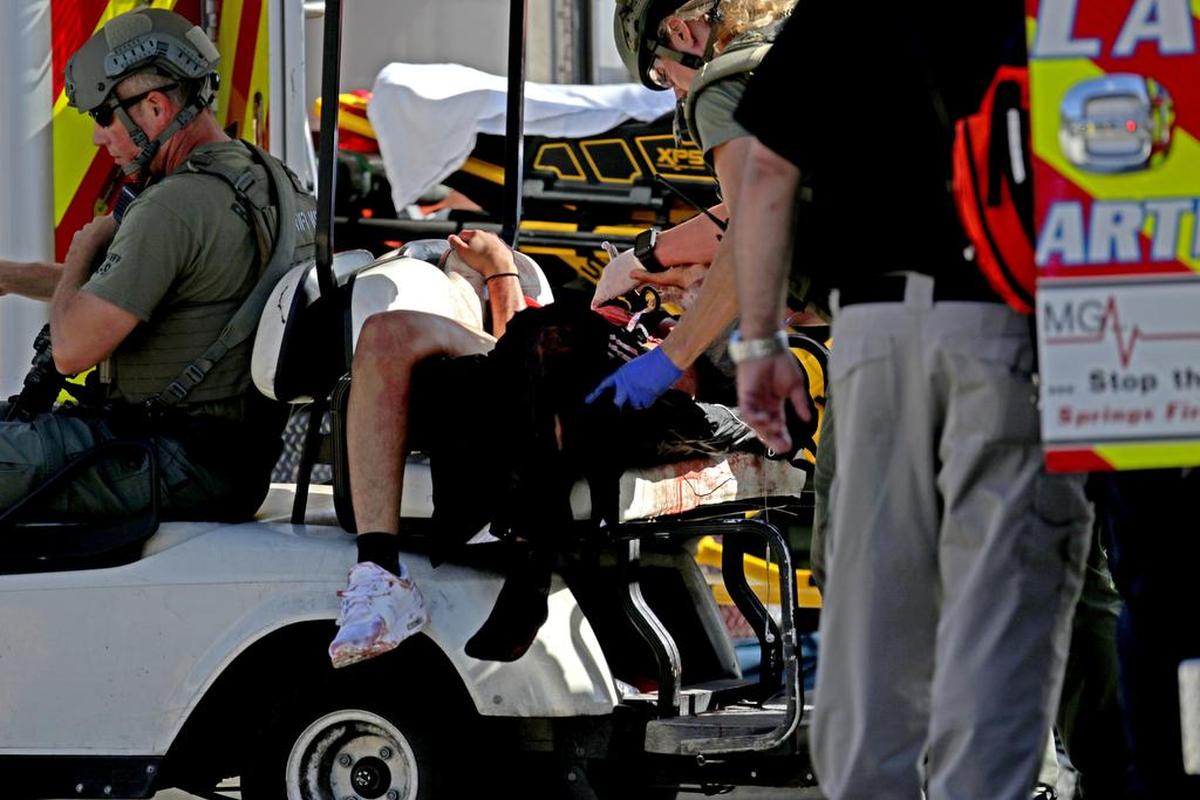 Medical personnel tend to a victim outside of Stoneman Douglas High School