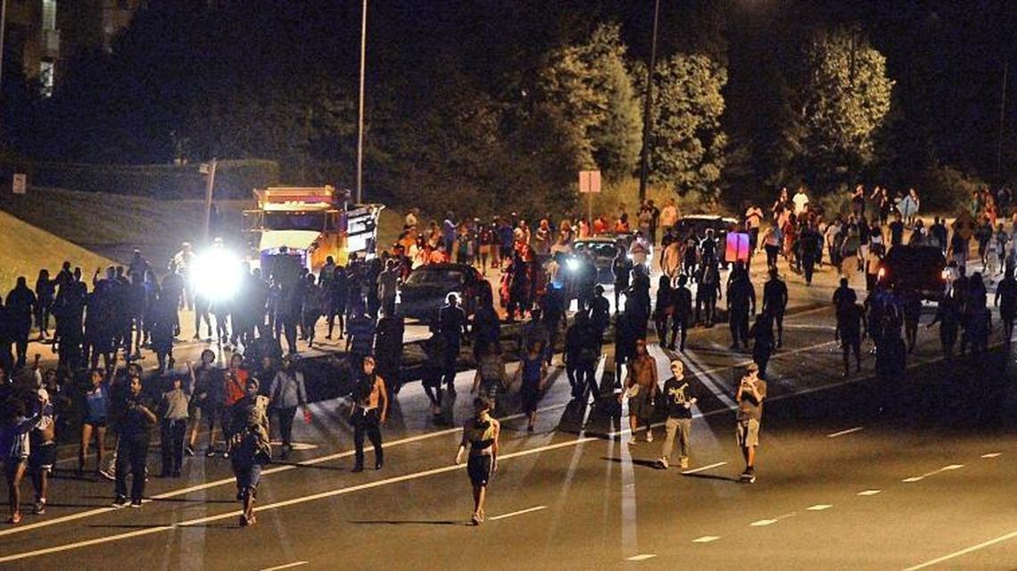 Protesters move down Harris Boulevard en route to Interstate 85 in Charlotte on Sept. 21, 2016. A protest began on Old Concord Road at Bonnie Lane, where a Charlotte-Mecklenburg police officer fatally shot a man in the parking lot of The Village at College Downs apartment complex on Sept. 20, 2016..