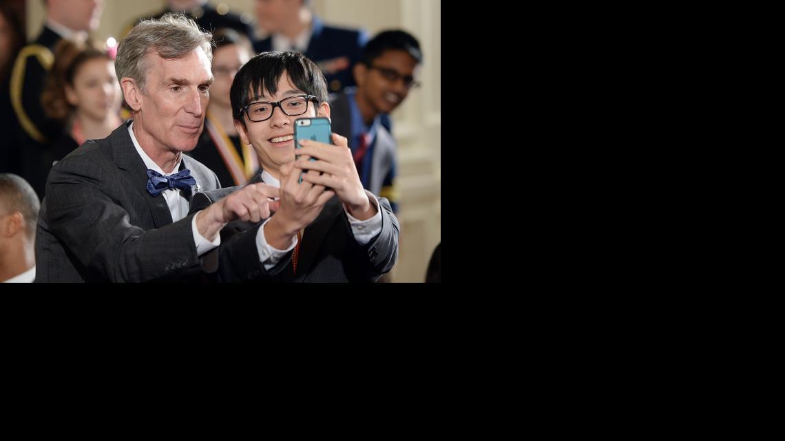 
Bill Nye, popularly known as Bill Nye the Science Guy, poses with a student in the Roosevelt Room of the White House during the 2015 White House Science Fair on March 23, 2015 in Washington, D.C. 
