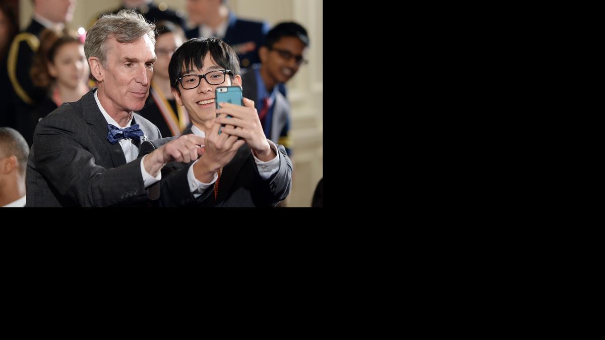 
Bill Nye, popularly known as Bill Nye the Science Guy, poses with a student in the Roosevelt Room of the White House during the 2015 White House Science Fair on March 23, 2015 in Washington, D.C. 
