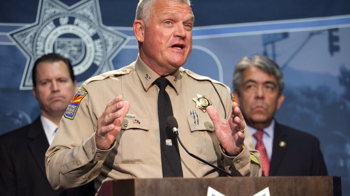 
Col.l Frank Milstead, director of the Department of Public Safety, announces the arrest of a suspect Friday night in the Phoenix freeway shootings. He is flanked by ATF Special Agent in Charge Tom Attteberry, left, and U.S Marshall for the District of Arizona David Gonzales.
