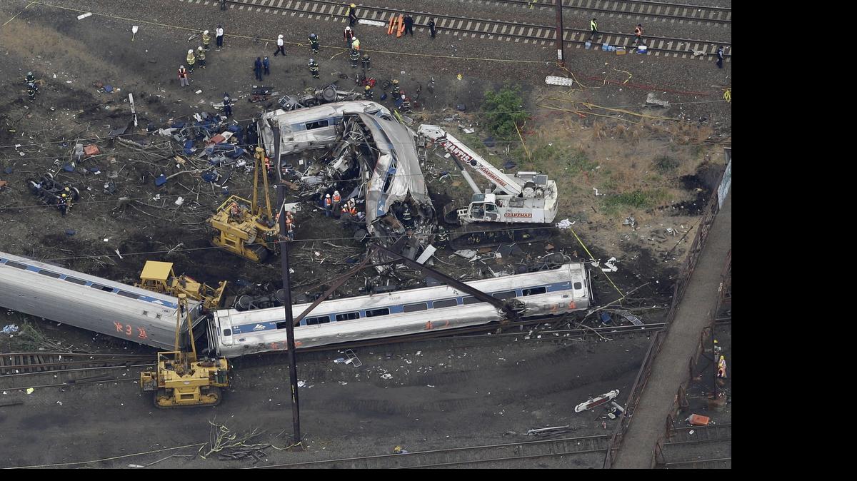 
Emergency personnel work at the scene of the deadly Amtrak train wreck Wednesday in Philadelphia. Federal investigators are trying to determine why the Amtrak train jumped the tracks in a wreck that killed eight people and injured dozens.
