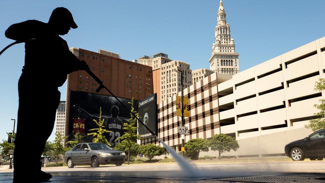 
A worker cleans the sidewalk in front of the Quicken Loans Arena in Cleveland, Wednesday in preparation for Thursday's first Republican presidential debate.
