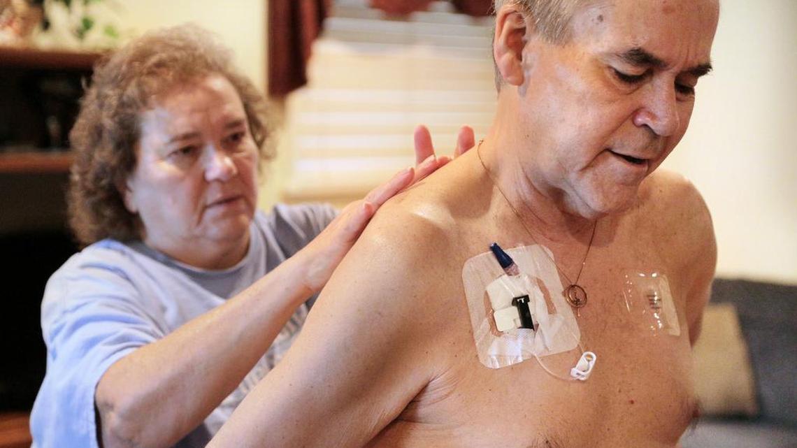 George "Smitty" Anderson receives pain-relieving Fentanyl patches on his back from his wife Pam inside their home in Augusta, Ga., on Aug. 22, 2015. He died at 62 on Nov. 5, 2015. Anderson worked at Savannah River Site for 17 years and said he developed multiple myeloma cancer from exposure while working at the plant. "From my knees up it hurts," he said. "It's affected every part of my life and my family's life." By August of this year, Smitty had lost a lot of weight, due in part to a blood clot and multiple surgeries on his left leg.