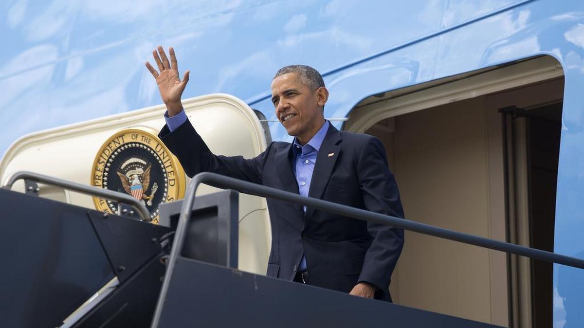 President Barack Obama waves upon his arrival Friday at Austin Bergstrom International Airport. Obama is in Texas to speak at South by Southwest Interactive Festival. He will also attend two Democratic National Committee fund-raisers.