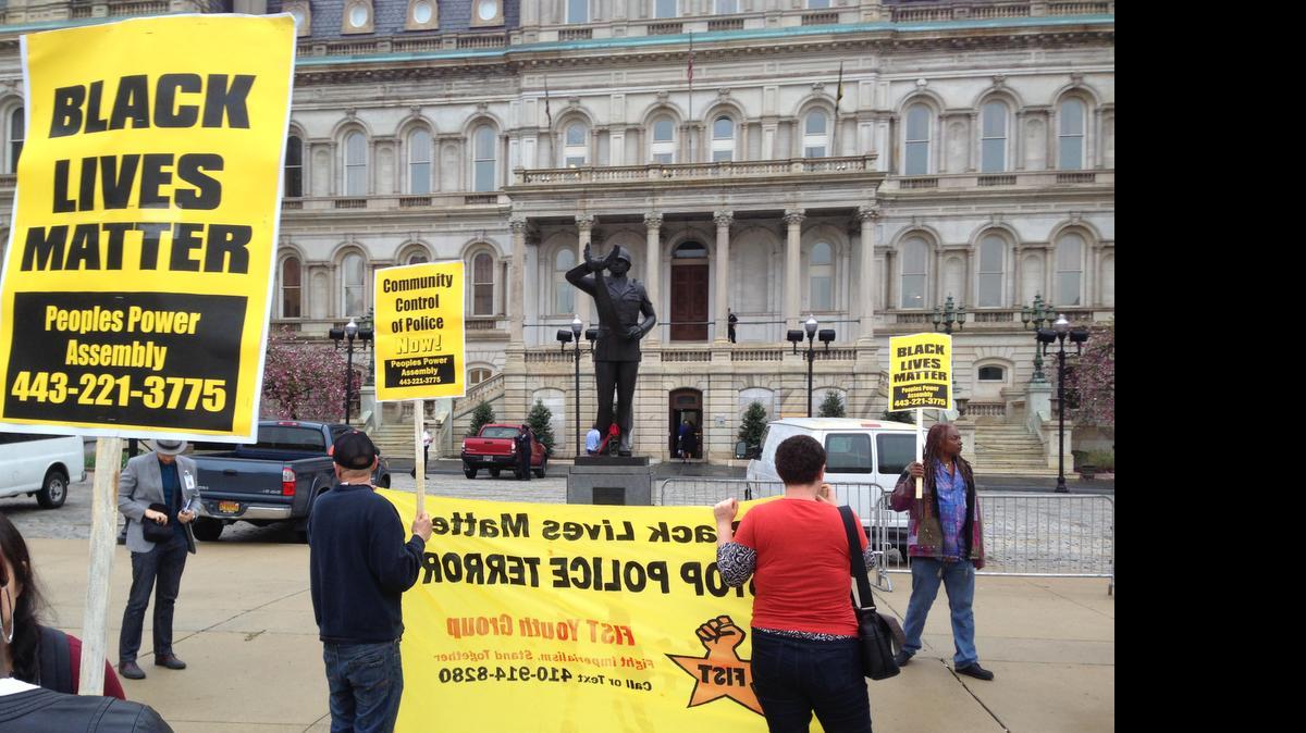
Demonstrators protest the death of Freddie Gray outside Baltimore City Hall on Monday, April 20, 2015. Gray died Sunday, a week after he was rushed to the hospital with spinal injuries following an encounter with four Baltimore police officers. 
