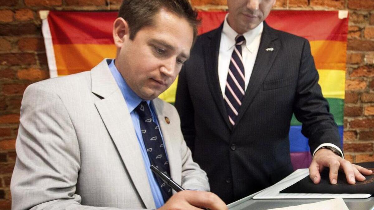 Rep. Chris Sgro, left, says House Bill 2 can’t be enforced by police, so transgender people are more worried about the general public “assessing what someone’s gender is” in bathrooms.
