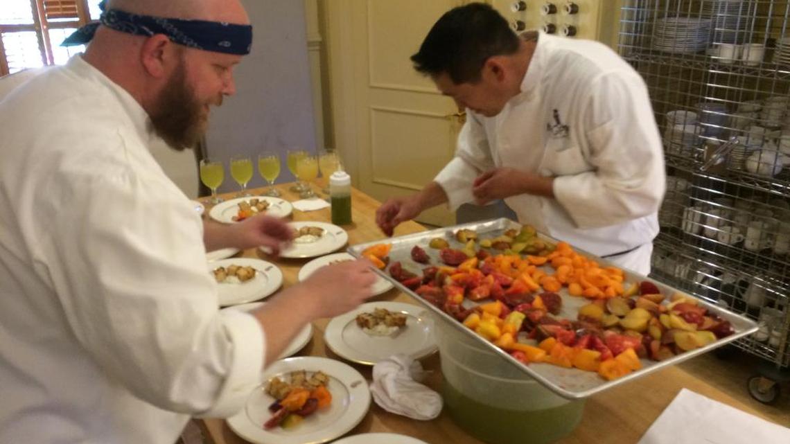 Steve Yarbrough and Chris Woo prepare lunch at the Leland Stanford Mansion.