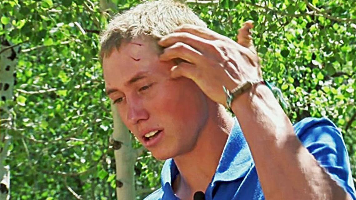 This still frame from video provided by KMGH-TV shows a teen staffer at a Colorado camp, who gave only his first name, Dylan, describing how he fought off a bear after waking up to find the animal biting his head and trying to drag him away at the camp near Ward, Colo., Sunday, July 9, 2017. The 19-year-old was awakened around 4 a.m. to a "crunching sound" with his head inside the mouth of the bear, which was trying to pull him out of his sleeping bag as he slept outside at the camp 48 miles (77 kilometers) northwest of Denver.