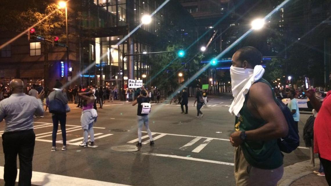 Police fired tear gas at protesters Wednesday night at the entrance to the Omni Hotel in uptown Charlotte.