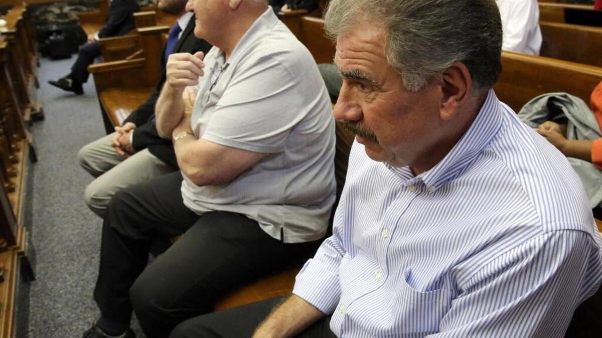 
Badger Guns owner Adam Allan, left, his father Walter Allan, right, and Mick Beatovic, center, listen to testimony in Milwaukee on Oct. 5, 2015, during the trial of a civil lawsuit. Two police officers say Badger Guns has sold hundreds of weapons used in crimes. Badger Guns has since closed, and a gun shop called Brew City Shooters Supply operates in the same location. Badger Guns was previously known as Badger Outdoors. All three entities have been run by Allan family members and Beatovic, another owner. 
