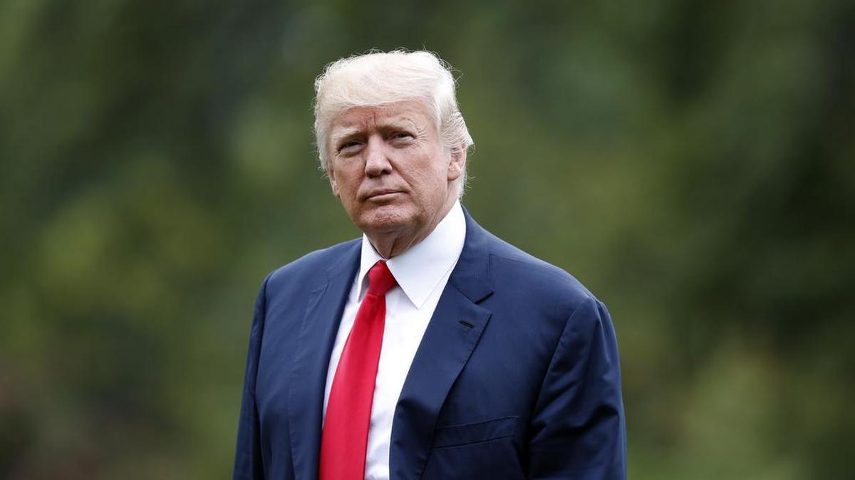 President Donald Trump walks to the White House as he arrives on the South Lawn, Monday, Aug. 14, 2017, in Washington. Trump is returning from a vacation to Bedminster, N.J.