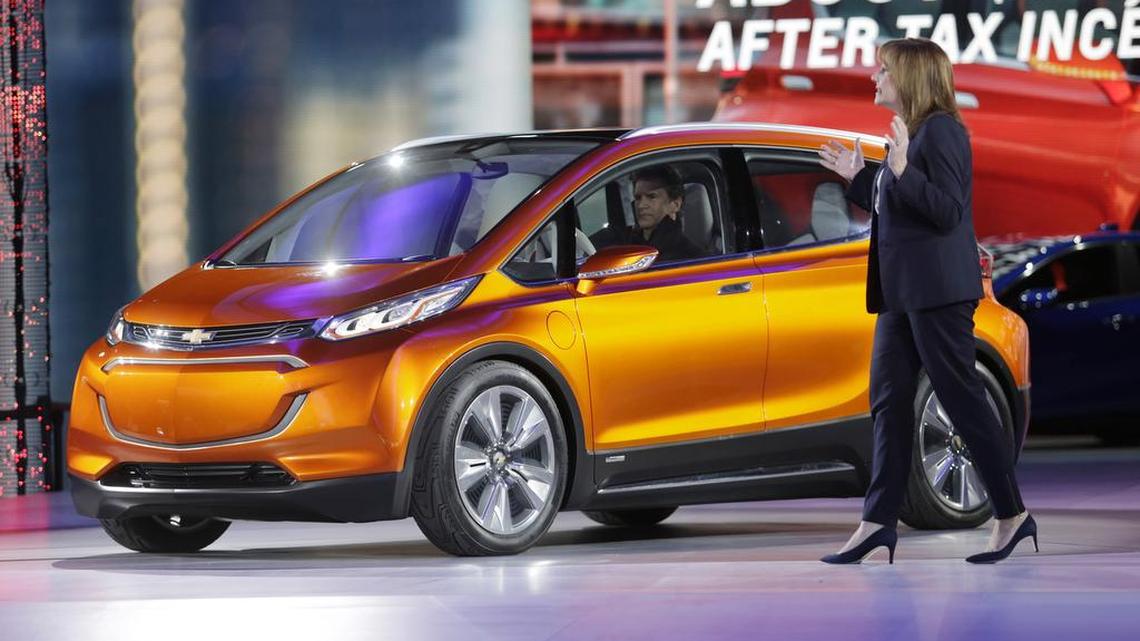 General Motors CEO Mary Barra unveils the Chevrolet Bolt EV, an all-electric concept car, at the North American International Auto Show on Monday Jan. 12, 2015 in Detroit.