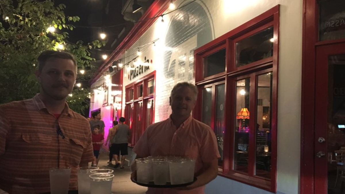 Chris Sommers, owner of Pi Pizzeria in St. Louis, handed out water to a crowd protesting the acquittal of a cop who had been on trial for killing a black man.