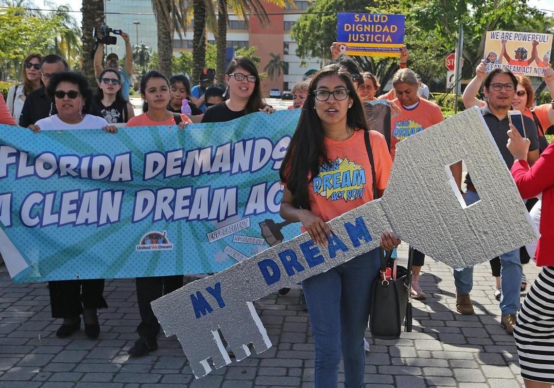 Nery Lopez, a DACA recipient, right, carries the ‘Dream Key’ as she leads supporters of Dreamers, made up immigrant youths, mothers and community members from United We Dream, We Belong Together, Students Working for Equal Rights (SWER), Florida Immigrant Coalition (FLIC), We Count!, Women Working Together, Friends of Miami-Dade Detainees, and Florida Student Power Network marched up to the front doors of Senator Rubio’s district office in Doral, but were denied access due to the government shutdown and Sen. Rubio’s presence in Washington, D.C., for the end of the government shutdown on Monday, Jan. 22, 2018.