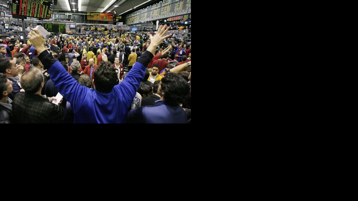 
A trader throws his hands into the air in January, 2008, during trading in the S&P 500 futures trading pit of the Chicago Mercantile Exchange in Chicago.
