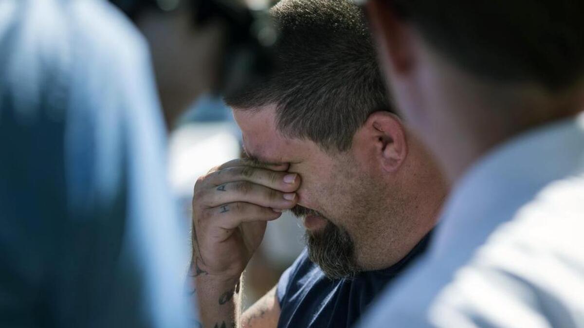 
Jeremy Bush, 38, holds back tears as he talks to reporters at a sinkhole that opened in Seffner, Fla. on Wednesday. His brother, Jeffrey Bush, was killed by the sinkhole in 2013.
