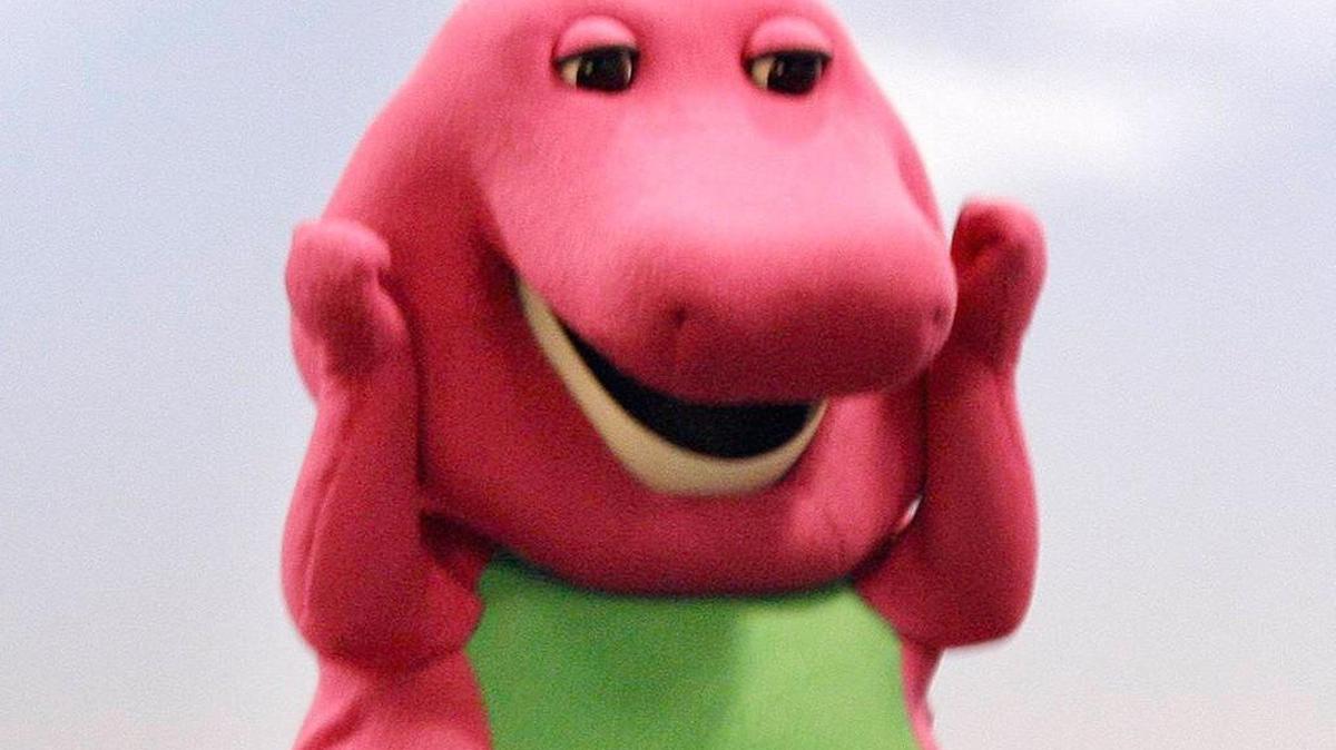 David Joyner wore a big purple costume for a decade in his job as Barney. He doesn’t hide his face in his current job — running a tantric sex business.