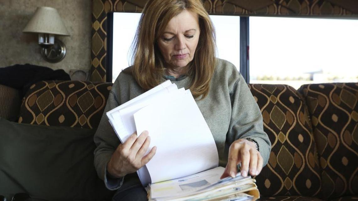 In this Oct. 22, 2016 photo, Kathy Thornton sifts through documents throughout her 39-year search for her sister Christine Thornton in Rawlins, Wyo. Christine disappeared during the summer of 1977 after leaving Texas on a road trip with her then-boyfriend to pan for gold in Montana.