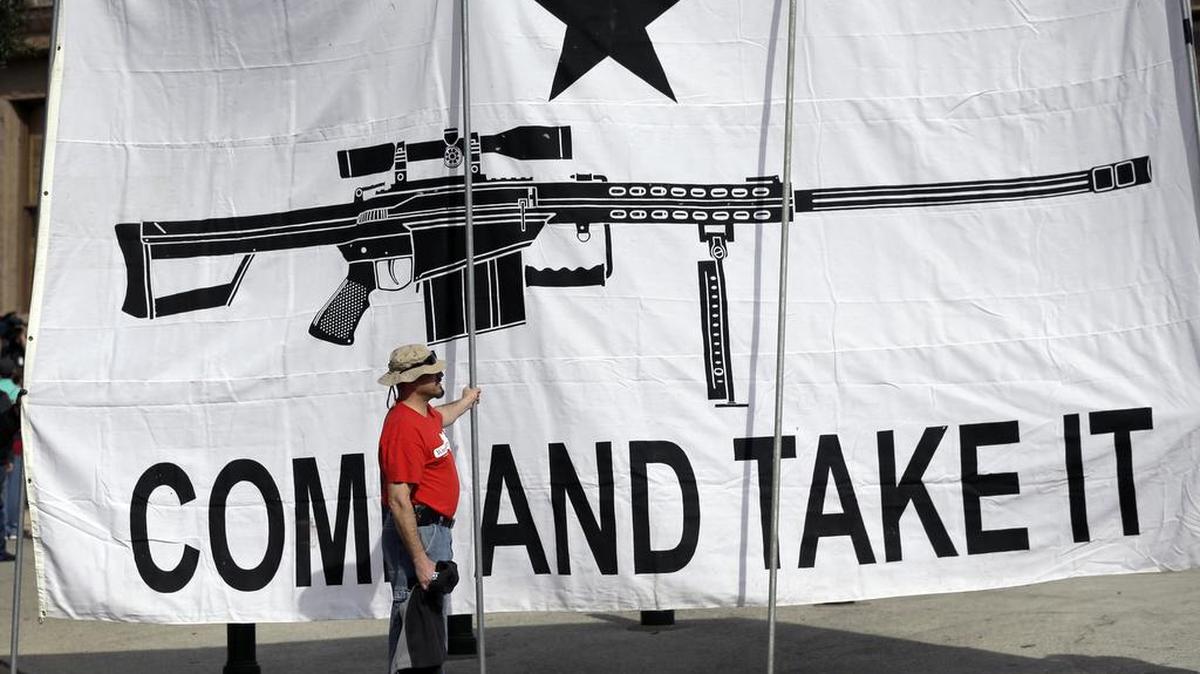 A demonstrator helps hold a large “Come and Take It” banner at a rally in support of open carry gun laws at the Capitol, in Austin, on Jan. 26, 2015. Despite its reputation as the trigger-happy heart of American gun culture, Texas is late to the open carry party, at least when it comes to handguns. On New Year’s Day, it’ll become the 45th state to legalize carrying a pistol in plain sight.