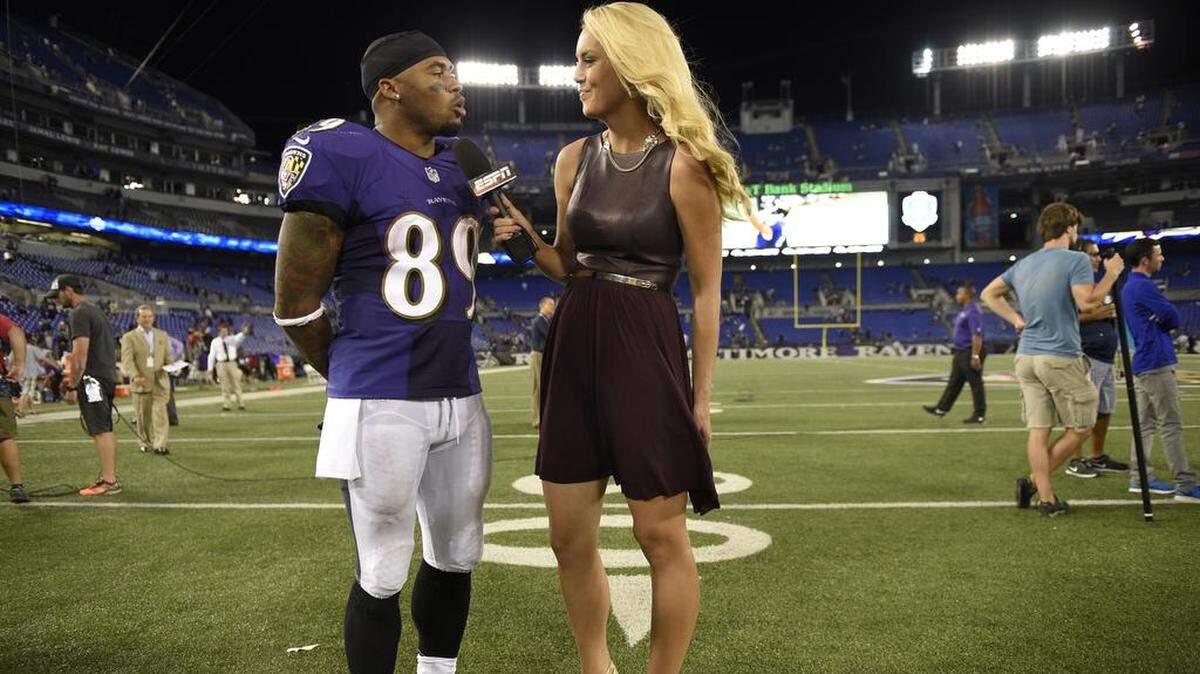Britt McHenry, right, interviews Baltimore Ravens wide receiver Steve Smith.