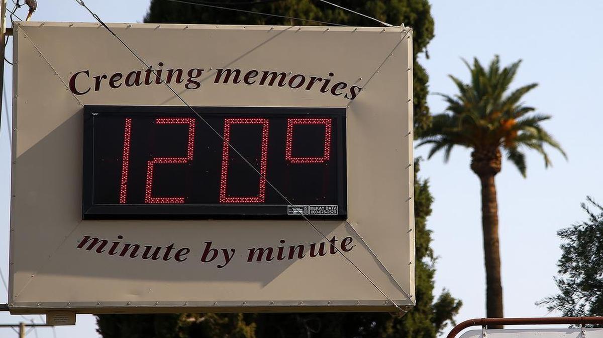 A local temperature sign reads 120-degrees as temperatures climb to near-record highs Tuesday, June 20, 2017, in Phoenix. The National Weather Service forecasts a high of 120 degrees (49 degrees Celsius), which is has only hit three times in recorded history in Phoenix, the last time 22 years ago.