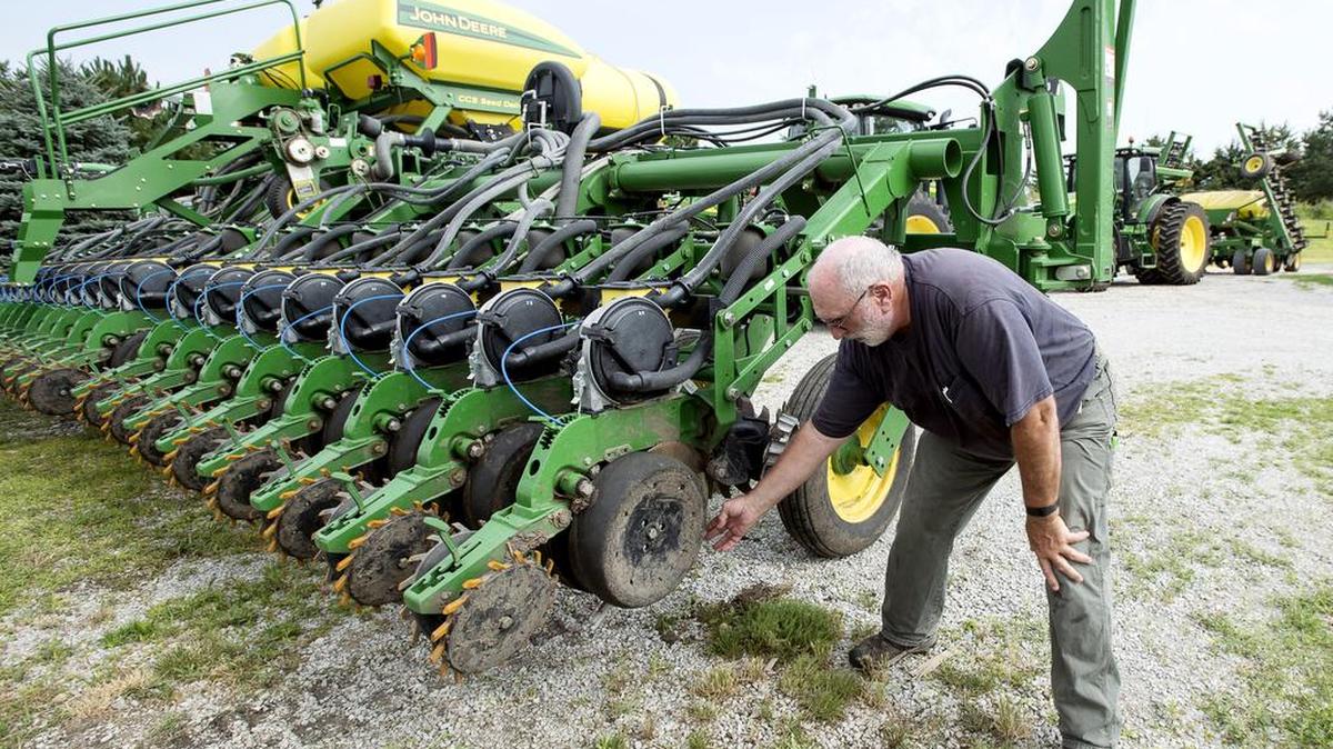 Farmer Mick Minchow takes a look at the fine components of his John Deere planter on Monday, June 20, 2016, at his farm in Waverly, Neb.