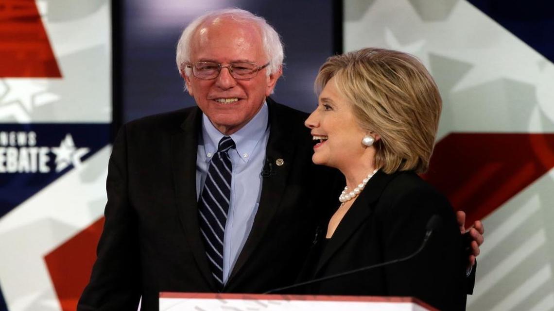 Hillary Rodham Clinton, right, talks to Bernie Sanders after a Democratic presidential primary debate, Saturday, Nov. 14, 2015, in Des Moines, Iowa.