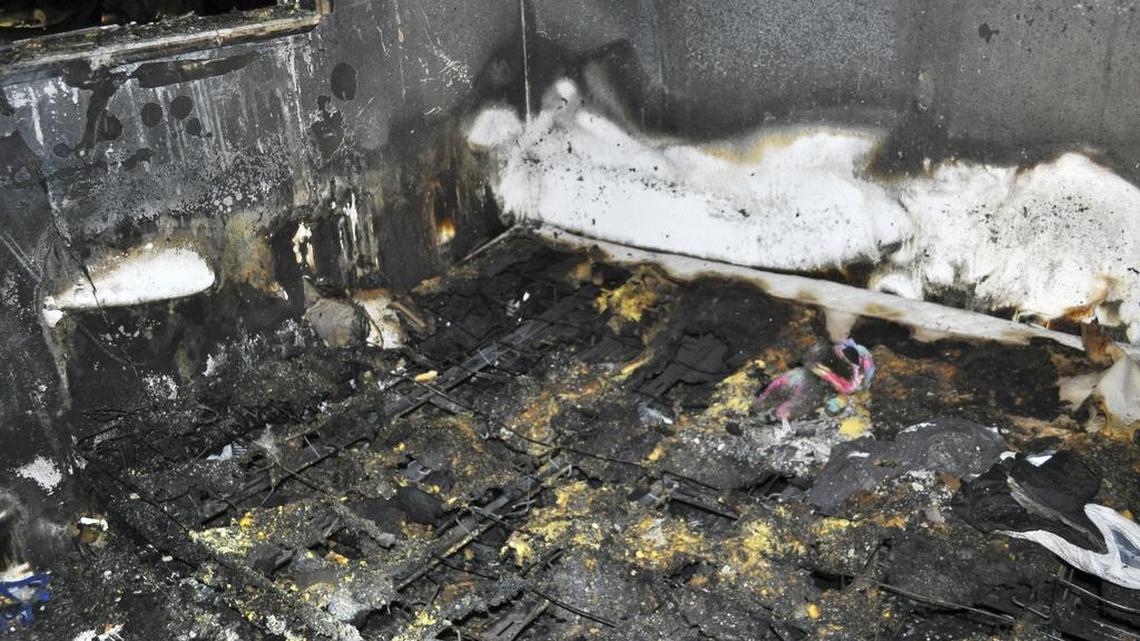 This photo provided by the Spokane, Wash., Fire Department shows the bed where a toddler and his dog died in a fire, Saturday, Oct. 22, 2016. The toddler was found with his dog and teddy bear next to him, and authorities believe the dog tried to protect the boy in the fire that broke out around 11:30 p.m. Friday, a spokesman for Spokane's fire department said Saturday.