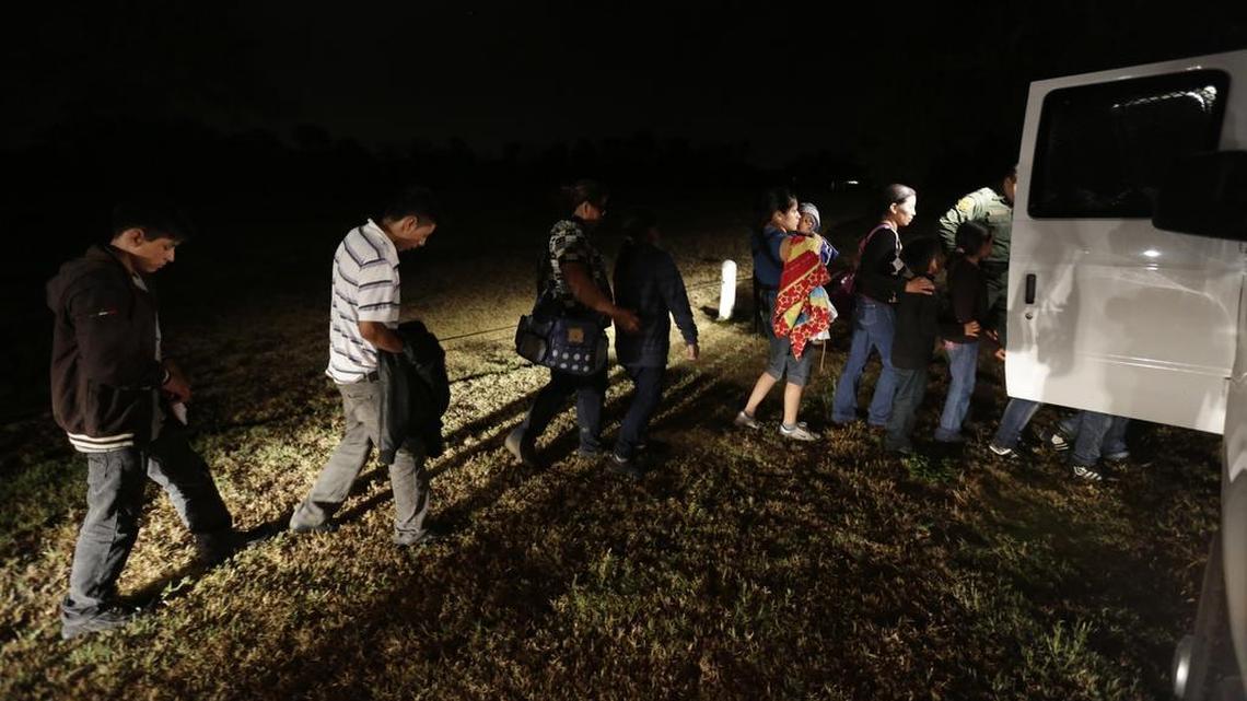 
A group of immigrants from Honduras and El Salvador who crossed the U.S.-Mexico border illegally are loaded on to a van in Granjeno, Texas on June 25, 2014. Federal officials released in the past day a half-dozen mothers and children who had been detained at a south Texas detention where they were held after fleeing Central America. 
