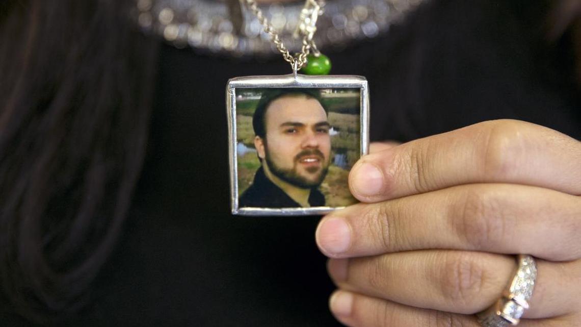 Naghmeh Abedini holds a necklace with a photograph of her husband, Saeed Abedini, on Capitol Hill in Washington in June 2015. Iran state television has reported that the government has released several dual-national prisoners. The Associated Press has confirmed that three of them were Washington Post reporter Jason Rezaian, former U.S. Marine Amir Hekmati and pastor Saeed Abedini.