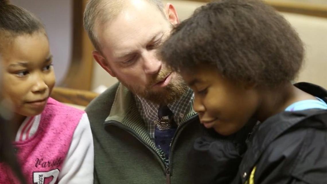 Joey Gilbert of Carnesville, Ga., talks to Alasjah Haynes, 7, of Waveland, and her sister, Jada, 12, before services at Bayside Baptist Church in Waveland on Sunday, Dec. 17, 2017.