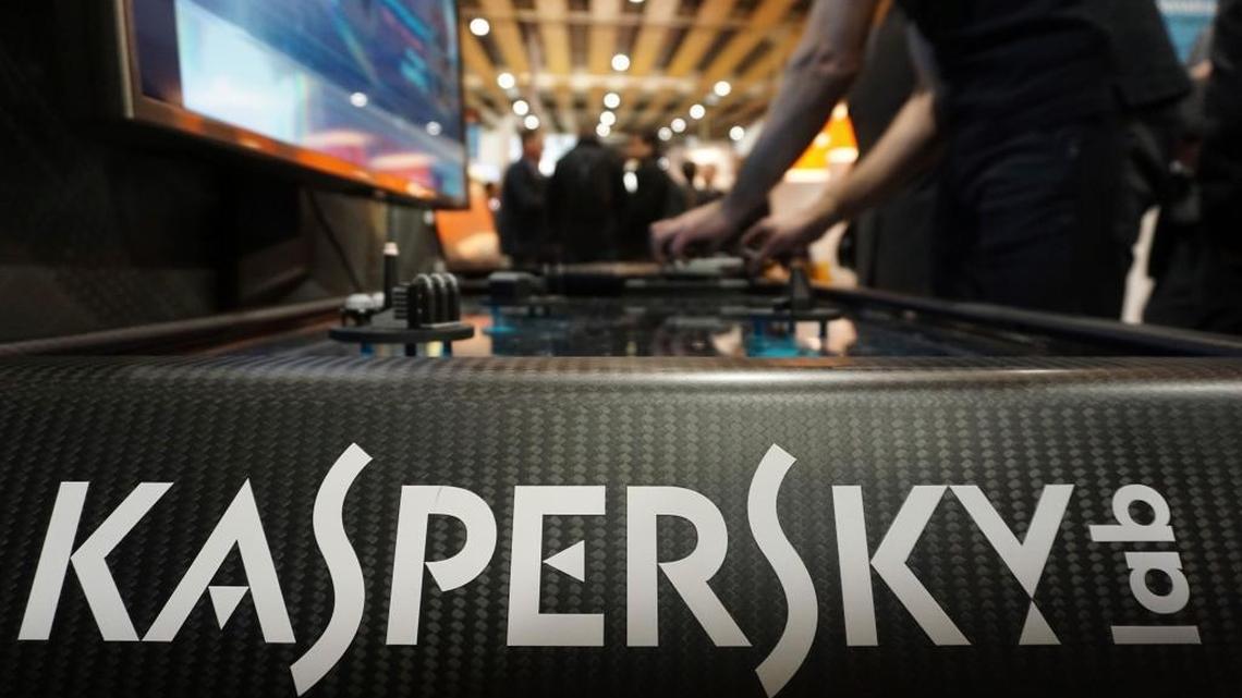 A Kaspersky employee shuffles tokens around a table-top display at the company's stand at a cybersecurity conference in Lille, northern France, on Wednesday, Jan. 25, 2017. Kaspersky says a senior manager at the firm was arrested in Moscow.