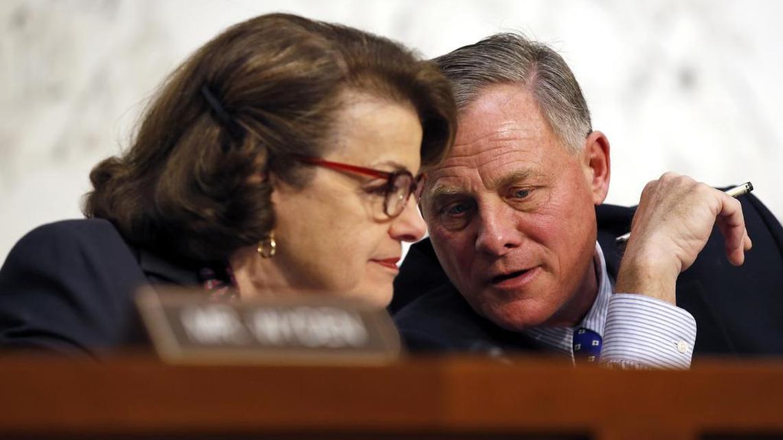 FILE - In this Feb. 9, 2016 file photo, Senate Intelligence Committee Vice Chair Sen. Dianne Feinstein, D-Calif., talks with committee chairman Sen. Richard Burr, R-N.C., on Capitol Hill in Washington. Burr, an ally to President-elect Donald Trump, is at the helm of a congressional probe into whether Russia directed cyberattacks with the intent to influence the 2016 presidential election.