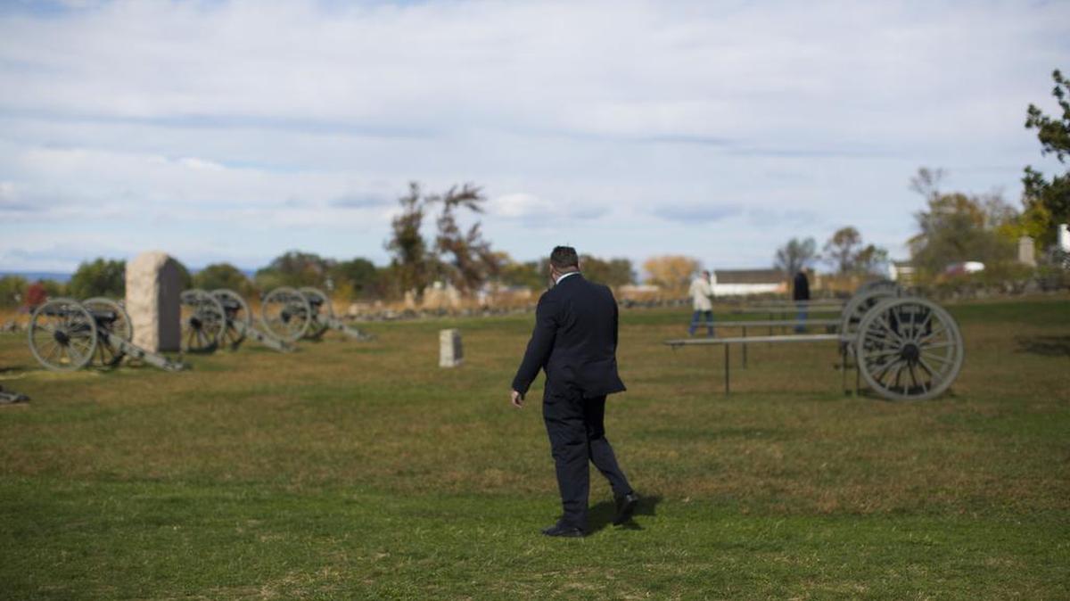 A Secret Service agent stands post as then-Republican presidential candidate Donald Trump tours Gettysburg National Military Park, Saturday, Oct. 22, 2016, in Gettysburg, Pa.