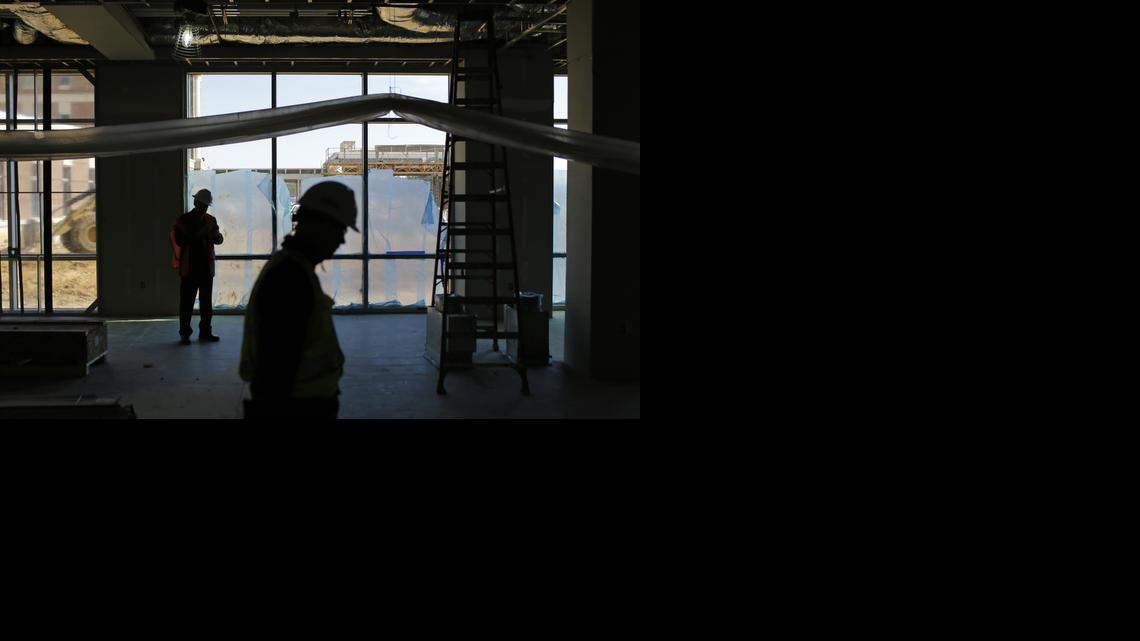 
In this March 12, 2015 photo, officials walk inside a Veterans Affairs outpatient clinic that is under construction in Fayetteville, N.C. The hospital's director since 2010, Elizabeth Goolsby, cites the VA's failure to expand quickly as a primary reason for why eastern North Carolina now has some of the longest waits for care in the country. 
